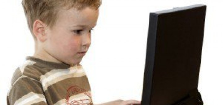 A boy using a laptop